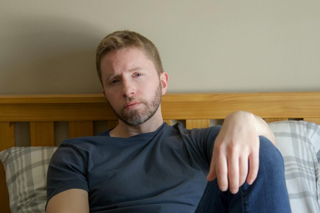 person sitting on a couch thinking about next steps