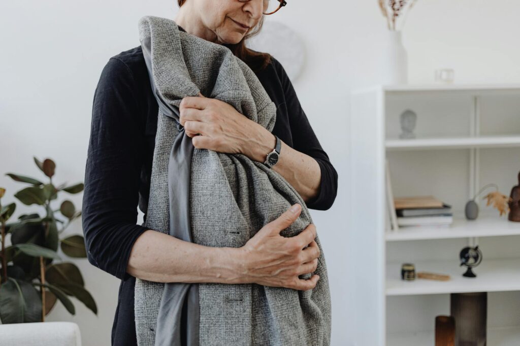 adult grieving a painful loss of community
