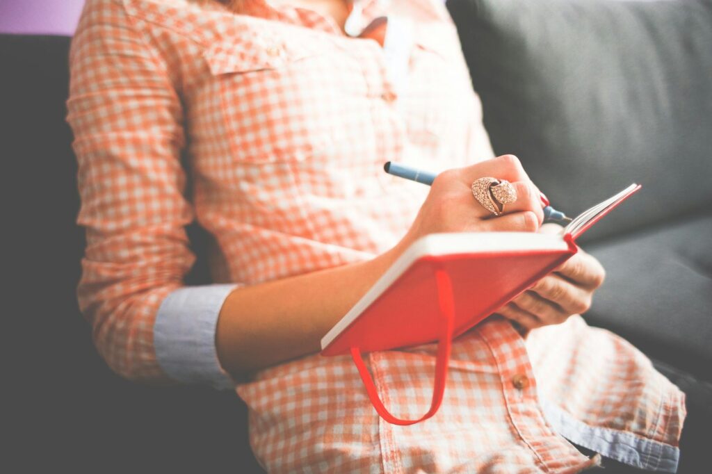 person journaling while rebuilding sense of identity