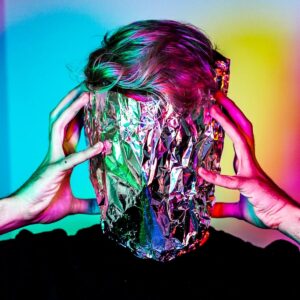 Person with foil over their face.