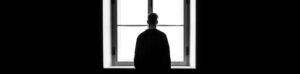 man standing in front of the window